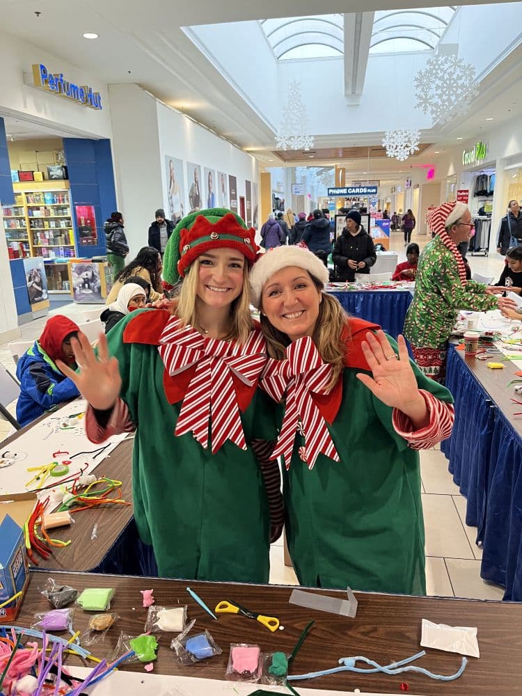 JoJoFun facilitators at a children’s arts and crafts station